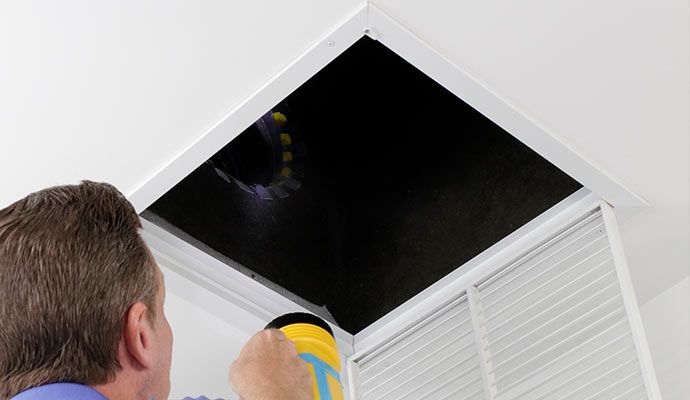 Person is cleaning air duct Person is cleaning air duct