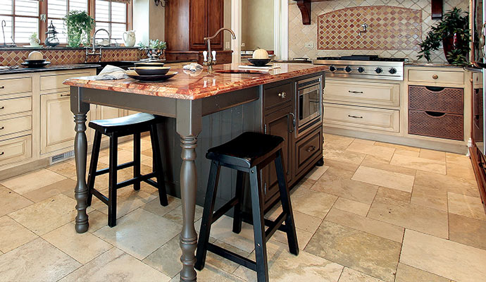 a kitchen with tiles installed on the floor