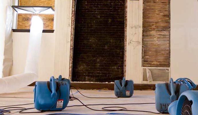 water damage restoration with dehumidifier